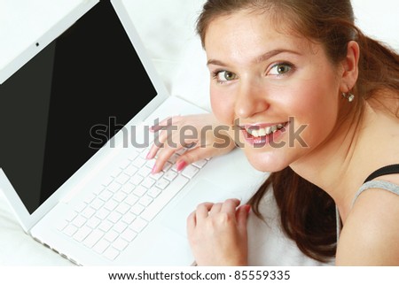 Happy teenage girl with laptop. Top view