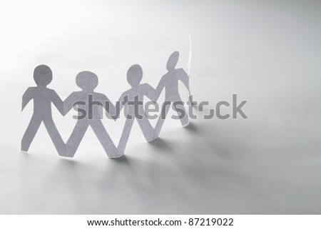 Chain of paper people isolated
