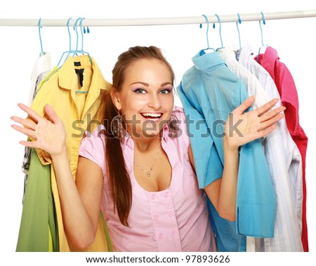 Beautiful woman shopping for some clothes at a store isolated on white background