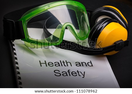 Health and safety register with goggles and earphones Health and safety register with goggles and earphones