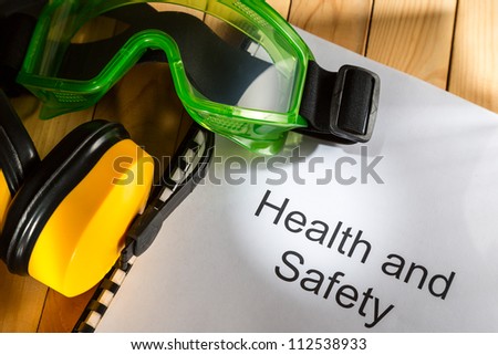 Register with goggles and earphones on wooden background