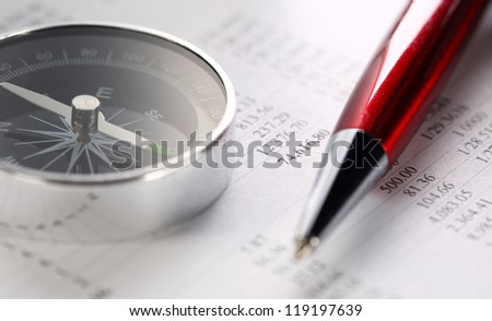 Operating budget, compass and pen