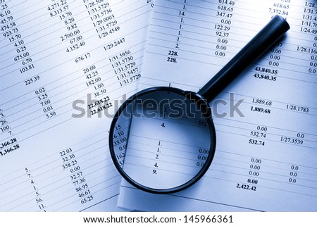 Operating budget and magnifying glass