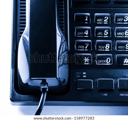 Telephone receiver in blue toning