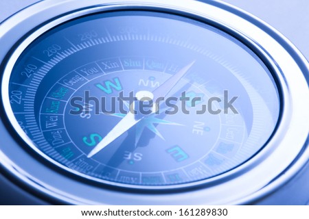 Compass closeup in blue toning