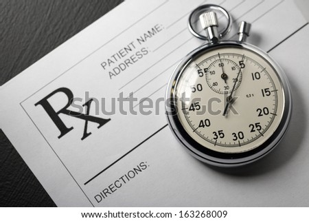 Blank patient list and stopwatch on black