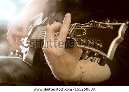 Electric Guitar In Male Hands