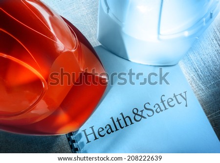 Health and safety with red and white helmets