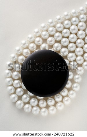 Black blank round badge on pearl background