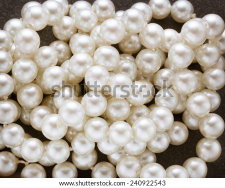Heap of white pearl on dark background