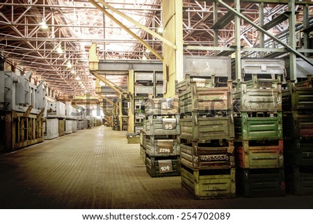 Big storage room with metal boxes in factory