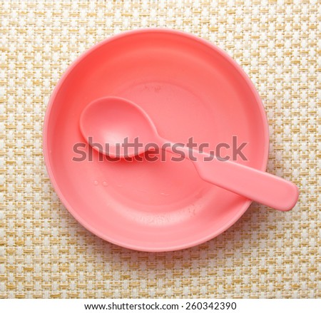 Pink plastic tableware dish, spoon and fork