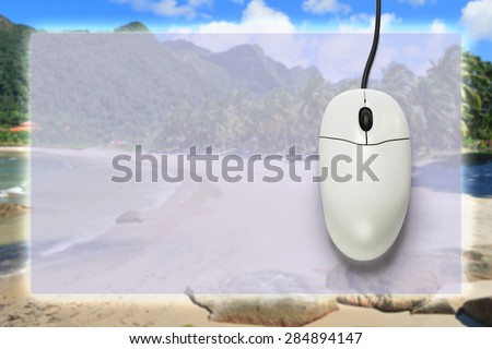 Computer mouse on travel background  in closeup
