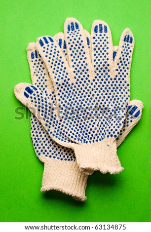 Gloves isolated on green background