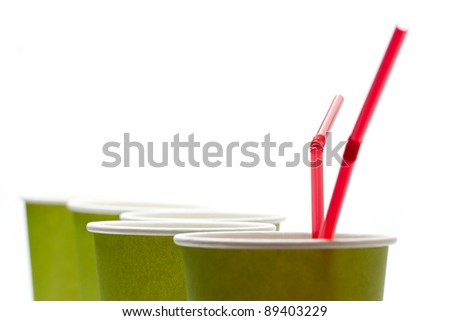 Paper cups with straws on a white background