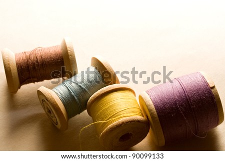 Many-coloured wooden bobbins