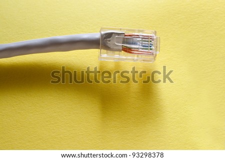 Ethernet cable for computer on yellow