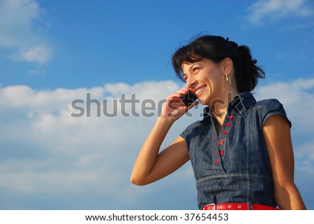 pretty young woman with cell phone, laughing
