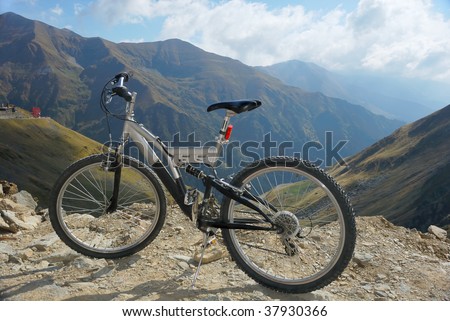 full suspension mountain bike on a rocky peak