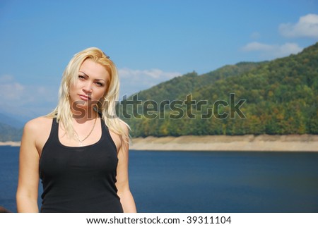 gorgeous young woman with blonde hair in a beautiful sunny day