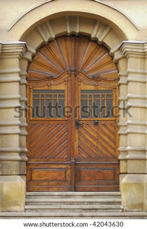 architectural detail of an old sculpted wooden door