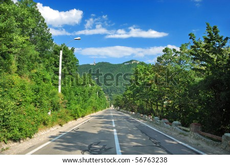 Straight road and leading lines to Tampa mountain in Brasov, Romania, Europe