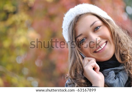 head of happy smiling girl talking on the phone