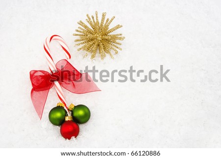 Red & White Striped Candy Cane with Red, Green and Gold Ornaments and Red Bow