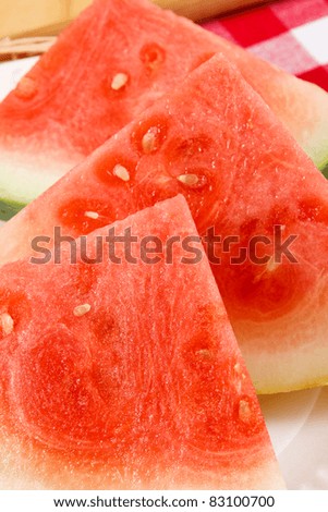 Juicy red watermelon slices ready to serve at picnic or barbecue