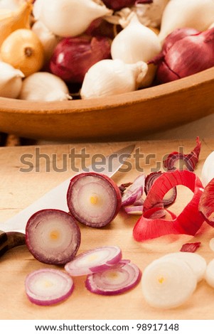Colorful sliced red pearl onions add flavor and eye appeal to cooked or raw food.