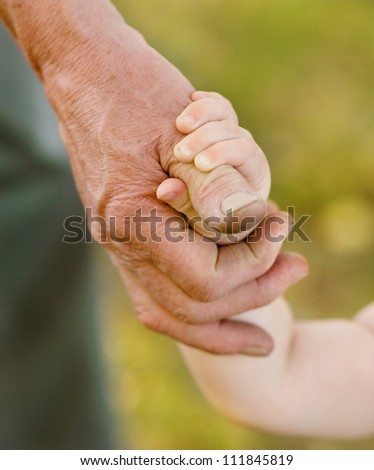 hands family grandson and old grandfather