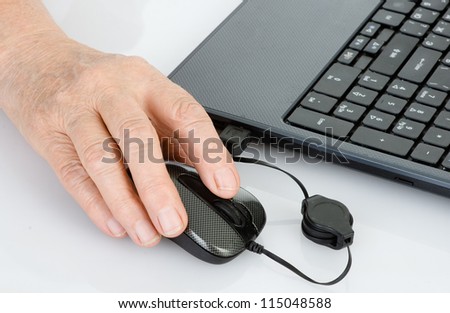 old hand using computer mouse
