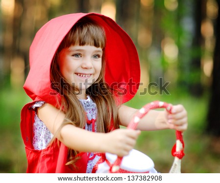 girl in the wood with a basket in hands. the fairy tale \
