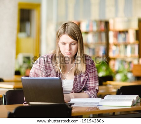girl using computer in a library
