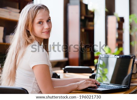 girl with laptop in classroom