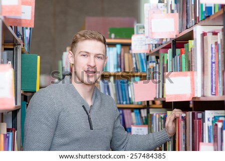 Portrait male student in library