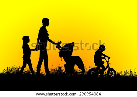 Mother with stroller and children walking at sunset.