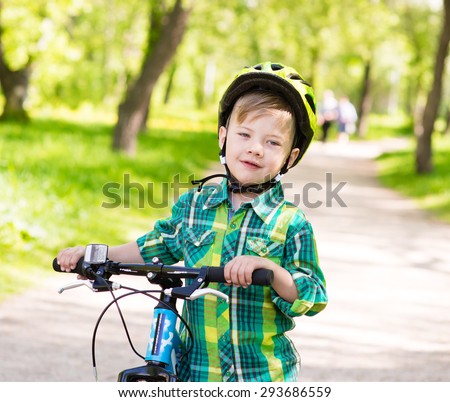boy learns to ride a bike
