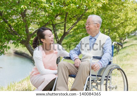 Japanese caregivers and senior smile in the field Japanese caregivers and senior smile in the field