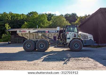 Hagenbach, Germany - May 31, 2014: Large Volvo Terex Truck TA 250 in open pit mining and processing plant for crushed stone, sand and gravel at polder Daxlander Au