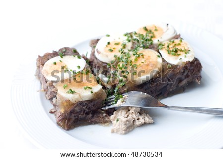 homemade jellied beef with cream horseradish on light background