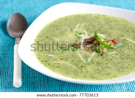 green soup with rocket, bacon and cheese