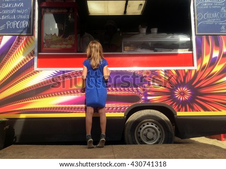 Girl in front of food truck