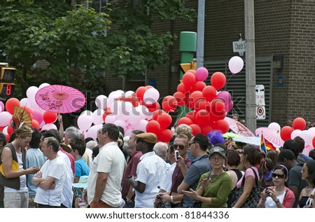 TORONTO, ONTARIO, CANADA - JULY 3: Unknown participants carrying balloons at the 2011 Annual Gay Pride Parade in Toronto on July 3, 2011.