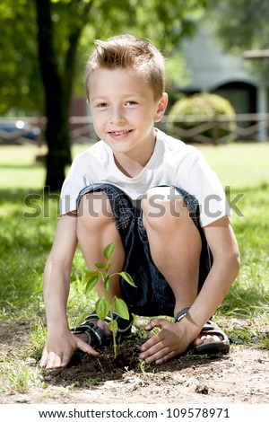 Little boy planting
