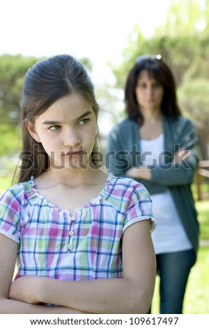 Little girl being told off by her mother
