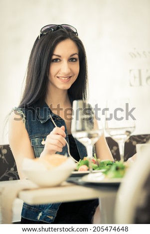 Young woman at the restaurant waiting for someone