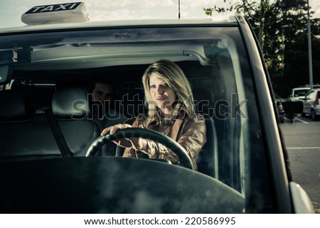 Female taxi driver with passenger