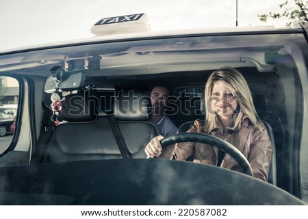 Female taxi driver with passenger