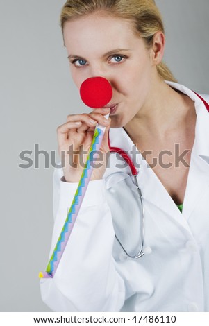 Female clown doctor with red nose